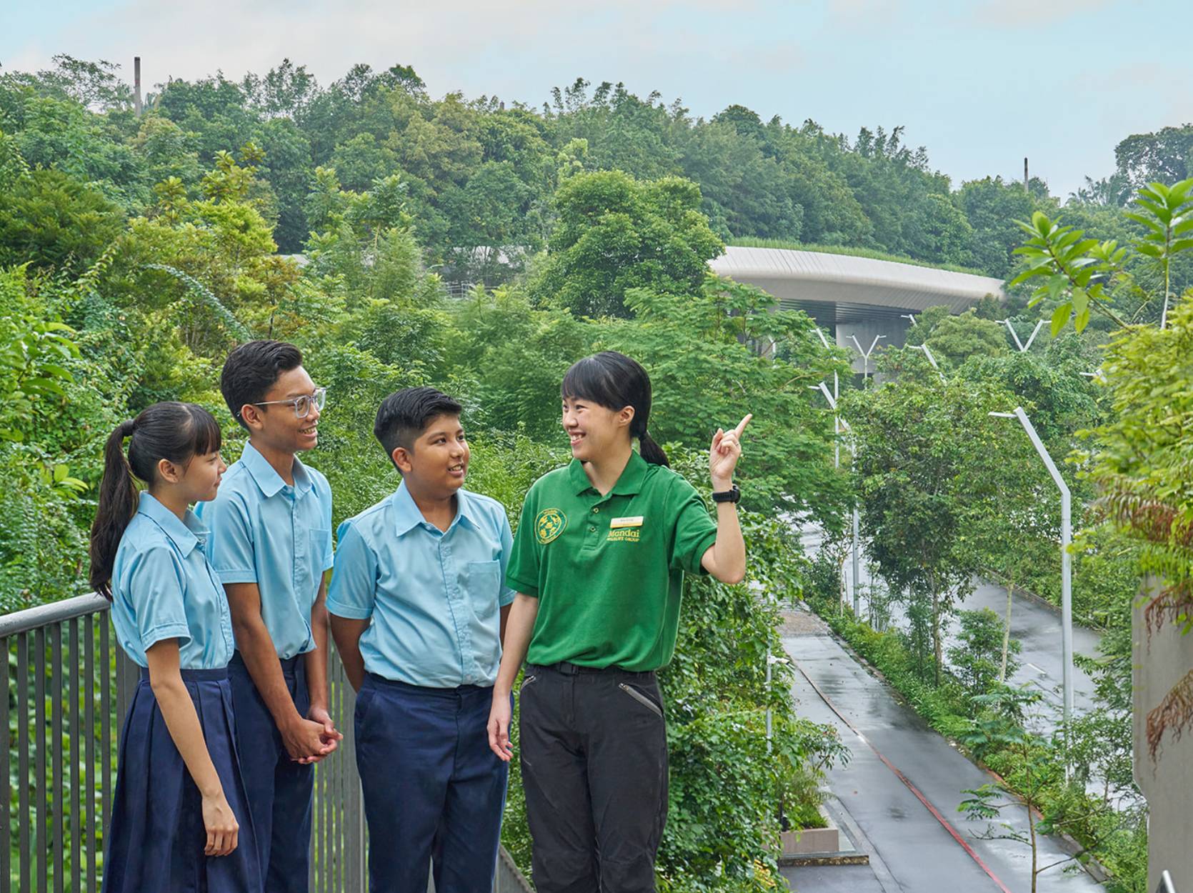 students with the eco-bridge in the background