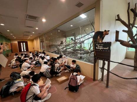 a group of students working on worksheets