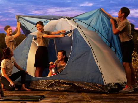 teenagers pitching tent
